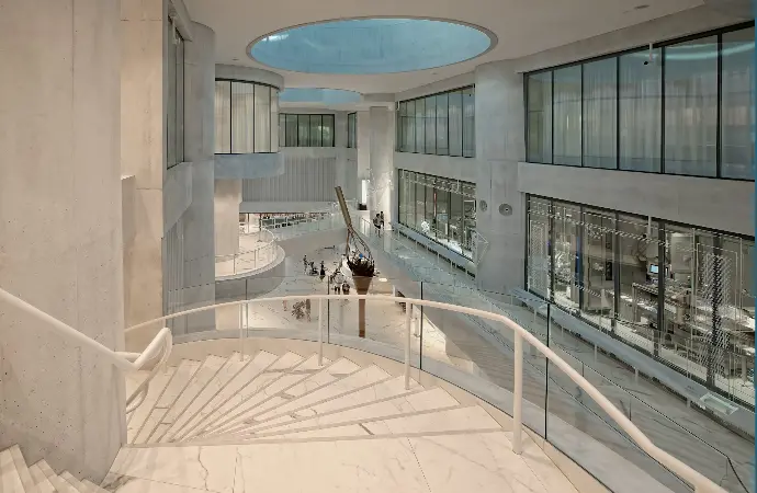 people walking on white concrete building during daytime